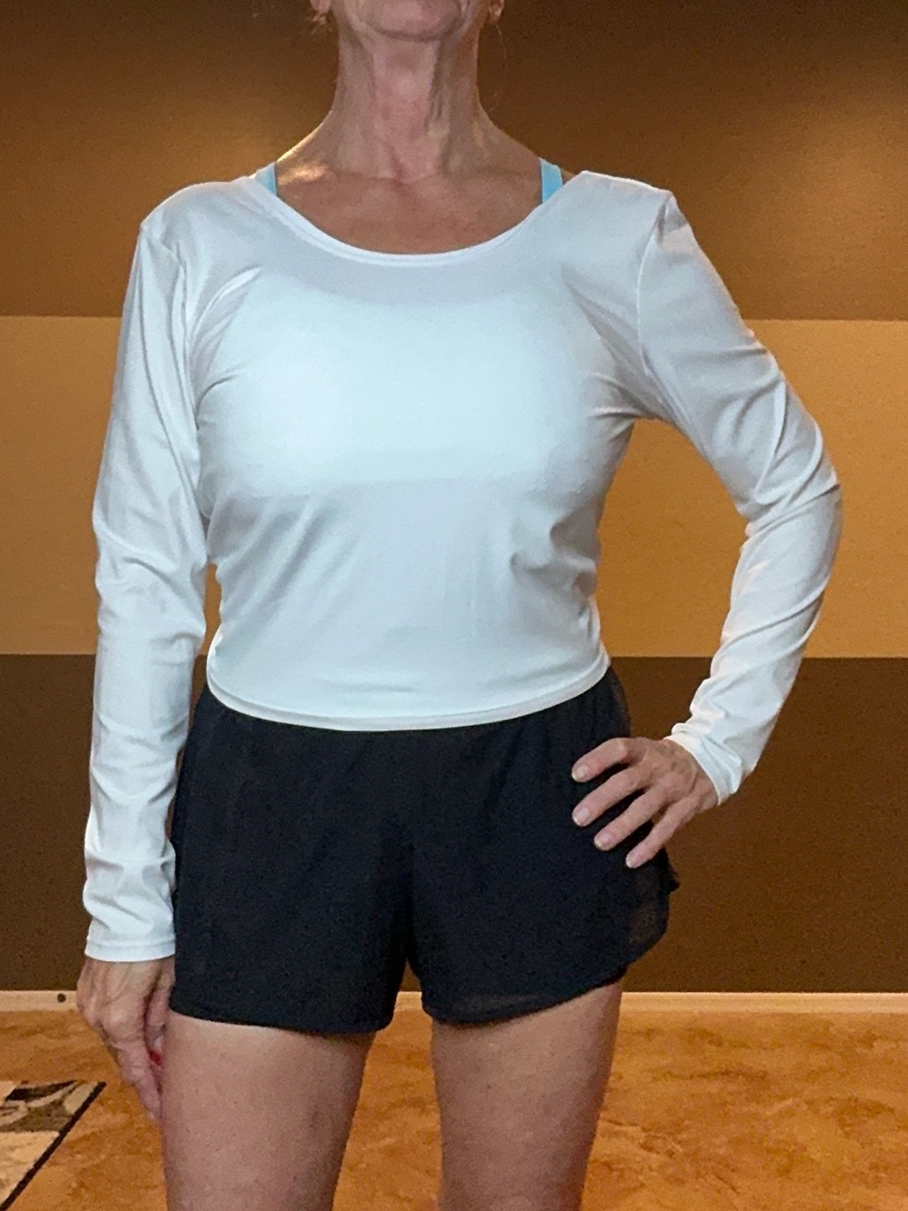 Sofia Vergara twist back athletic long sleeve top